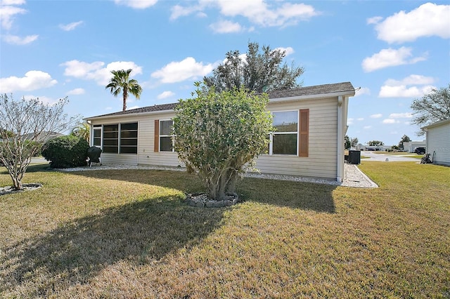 back of house with a yard