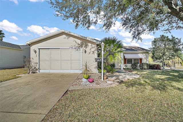 single story home with a garage and a front lawn