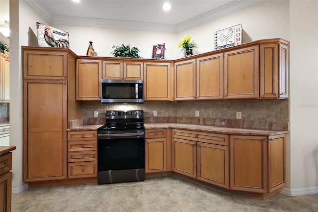 kitchen featuring brown cabinets, decorative backsplash, and appliances with stainless steel finishes