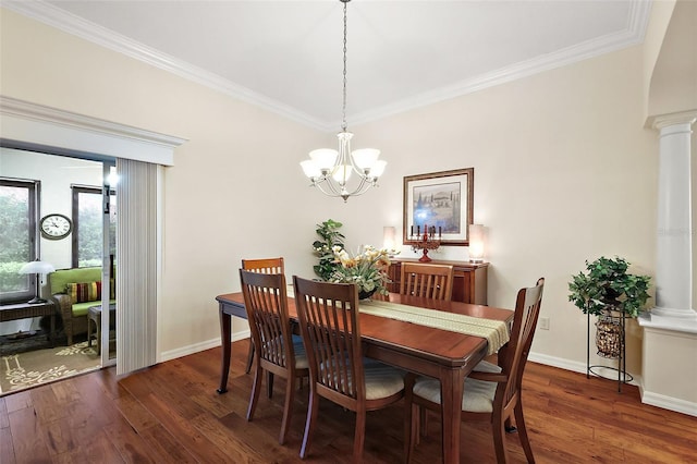 dining area with dark wood-style flooring, decorative columns, and ornamental molding