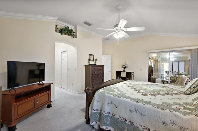 bedroom featuring light colored carpet, visible vents, crown molding, lofted ceiling, and arched walkways