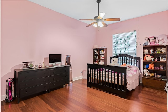 bedroom with wood-type flooring and ceiling fan