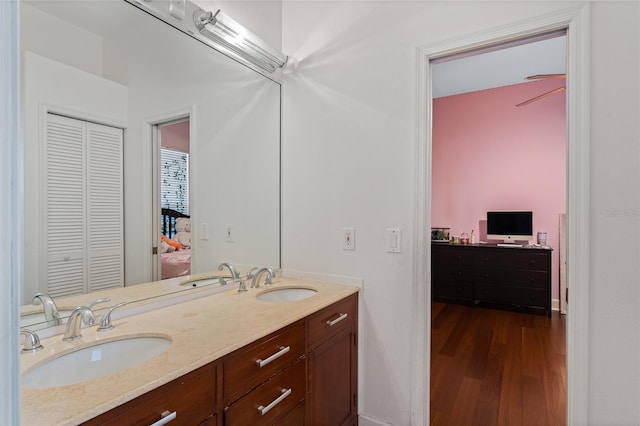 bathroom with hardwood / wood-style flooring and vanity