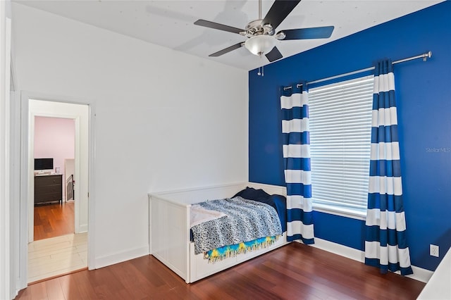 bedroom featuring wood-type flooring and ceiling fan