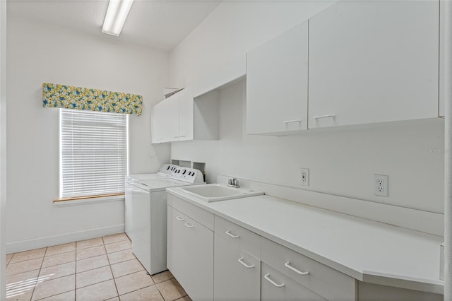 washroom featuring cabinets, sink, light tile patterned floors, and independent washer and dryer