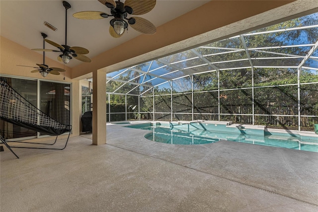 view of pool with ceiling fan, a lanai, and a patio area