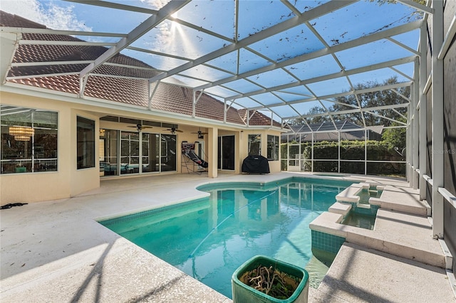 view of pool with ceiling fan, a grill, a lanai, and a patio