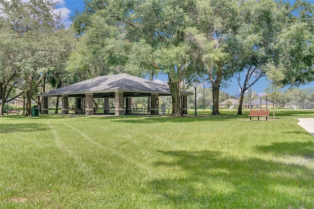 view of property's community with a gazebo and a yard