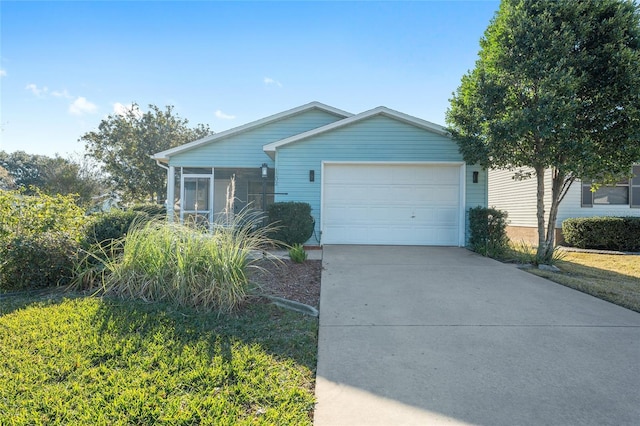 single story home with a garage and a front lawn