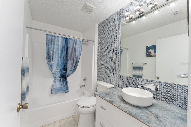 full bathroom featuring backsplash, toilet, shower / bath combo, tile patterned floors, and a textured ceiling