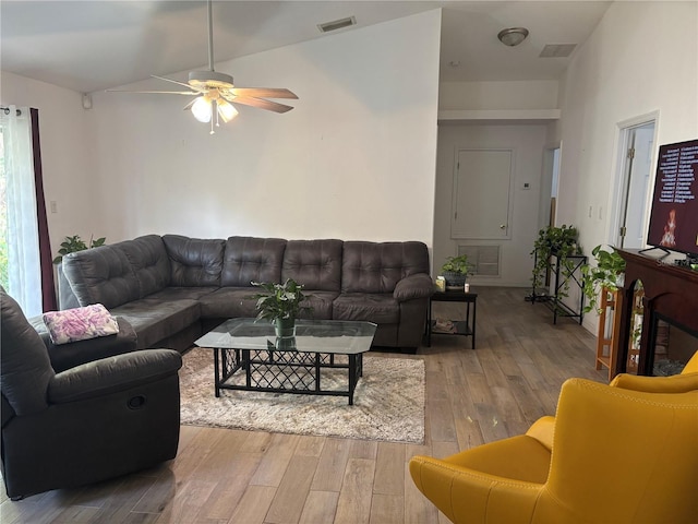 living room featuring ceiling fan and light wood-type flooring