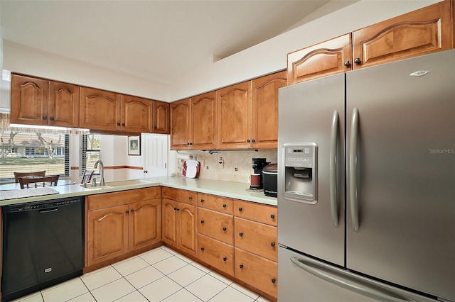 kitchen featuring sink, stainless steel fridge with ice dispenser, light tile patterned floors, dishwasher, and decorative backsplash