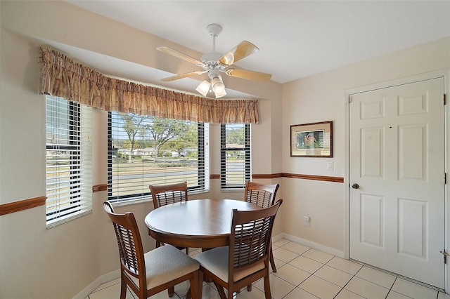 dining space featuring light tile patterned flooring and ceiling fan