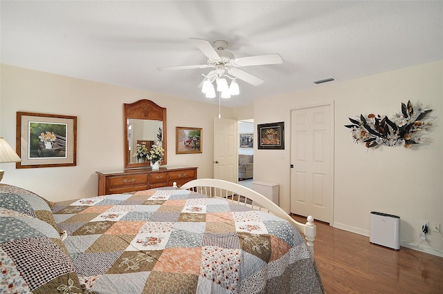 bedroom featuring dark hardwood / wood-style flooring and ceiling fan