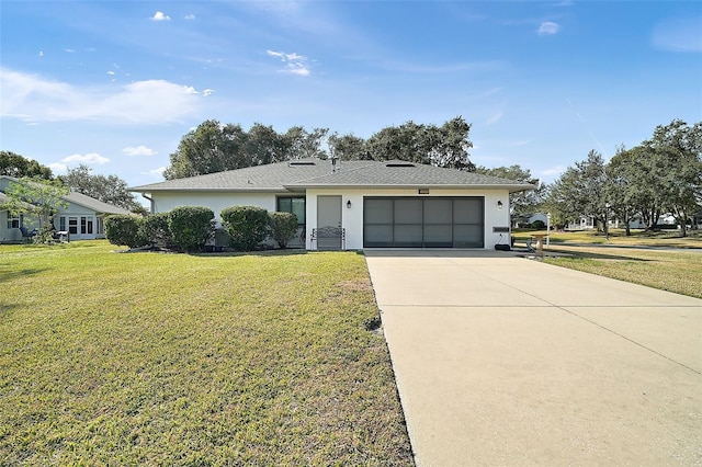 single story home with a garage and a front yard