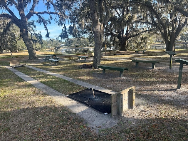 view of community with a water view