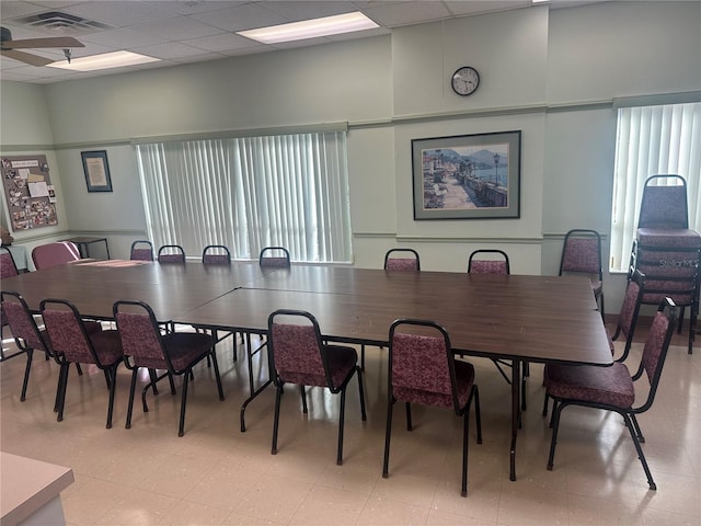 dining space featuring a paneled ceiling