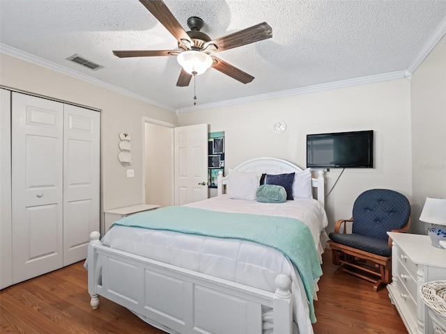 bedroom featuring ornamental molding and hardwood / wood-style floors