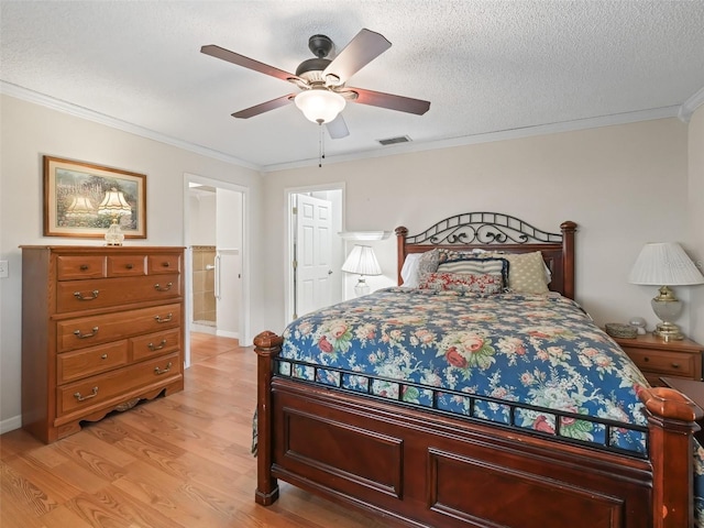 bedroom featuring ceiling fan, ornamental molding, light hardwood / wood-style flooring, and a textured ceiling