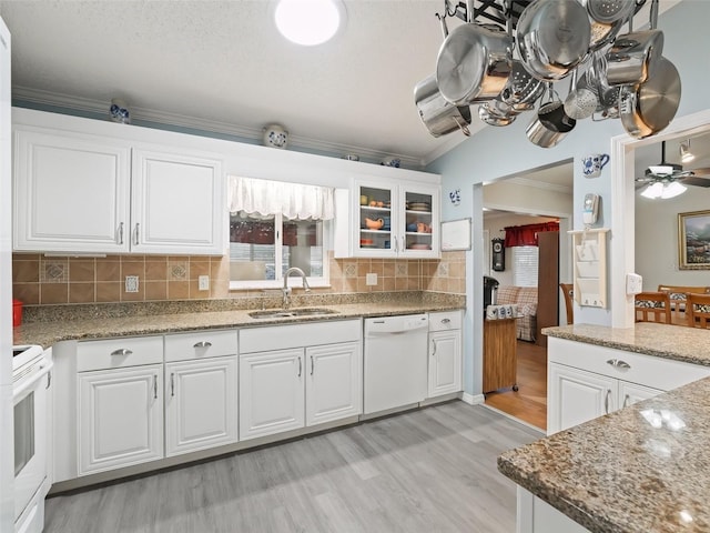 kitchen featuring white cabinetry, white appliances, sink, and stone counters