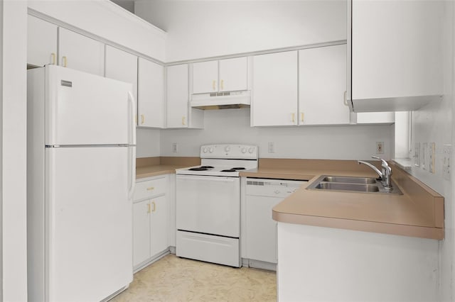 kitchen featuring sink, white cabinets, and white appliances