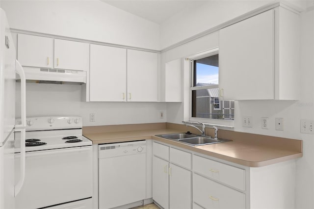 kitchen with white appliances, sink, and white cabinets