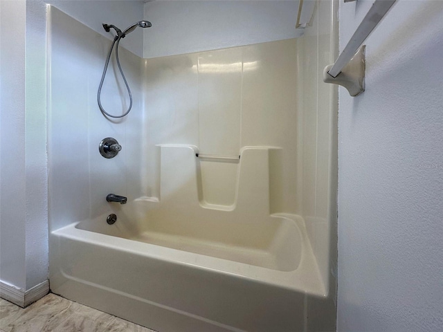 bathroom with washtub / shower combination