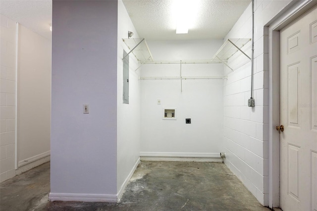 washroom featuring electric dryer hookup, washer hookup, and a textured ceiling