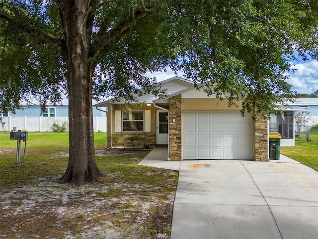 view of front facade with a garage and a front yard