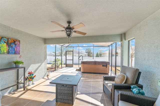 sunroom / solarium featuring ceiling fan