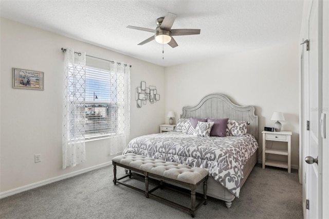 carpeted bedroom with ceiling fan and a textured ceiling