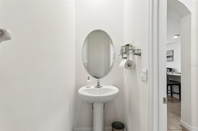 bathroom with tile patterned flooring