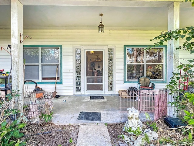 entrance to property featuring covered porch