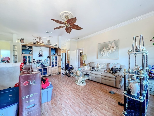 living room with tile patterned flooring, crown molding, and ceiling fan