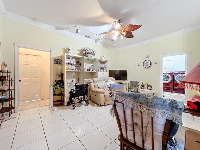 interior space with crown molding, independent washer and dryer, and ceiling fan