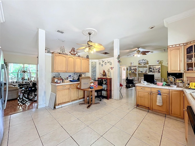 kitchen featuring crown molding, ceiling fan, light tile patterned flooring, and backsplash