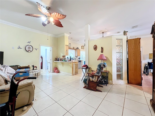 tiled living room featuring ornamental molding and ceiling fan