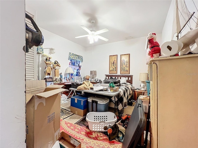 interior space with ceiling fan