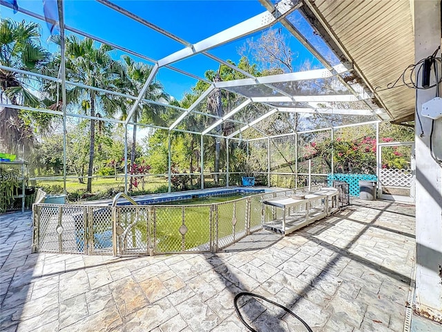 view of patio / terrace with a lanai