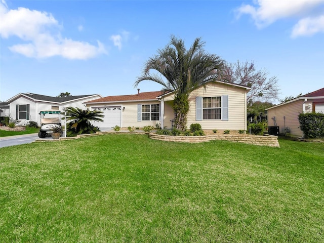 ranch-style home with a garage and a front yard