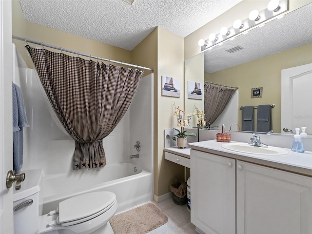 full bathroom featuring vanity, toilet, shower / bathtub combination with curtain, tile patterned floors, and a textured ceiling