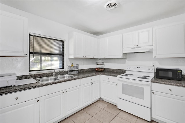 kitchen featuring white electric stove, sink, light tile patterned floors, and white cabinets