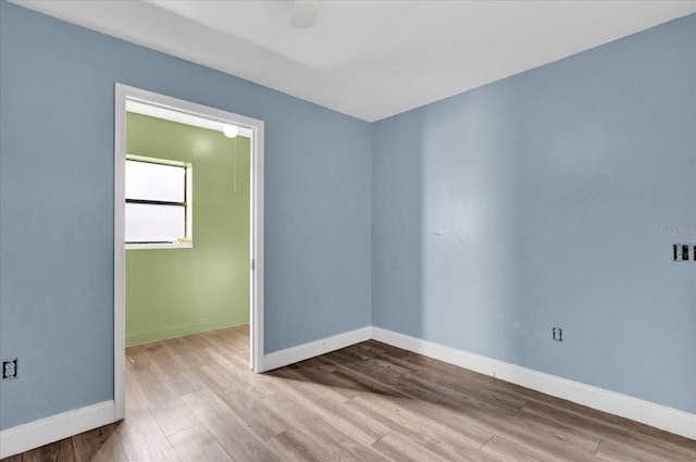 spare room featuring light hardwood / wood-style flooring