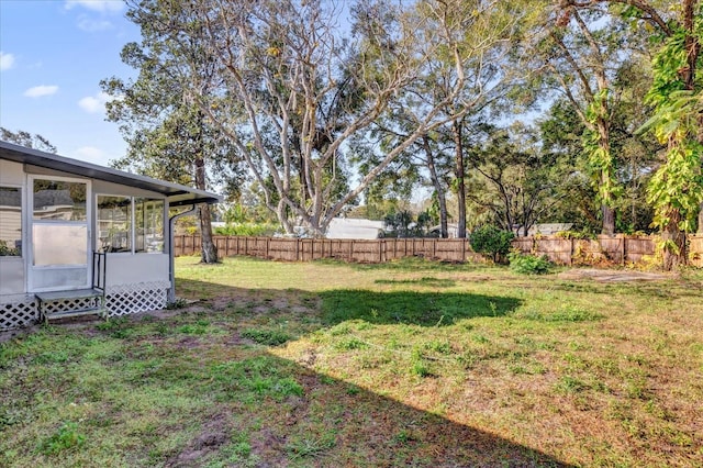 view of yard featuring a sunroom