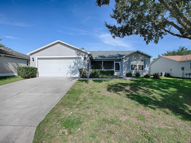 ranch-style house with a garage and a front yard