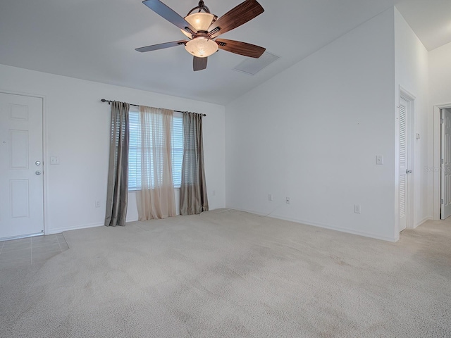 unfurnished room with lofted ceiling, light carpet, and ceiling fan