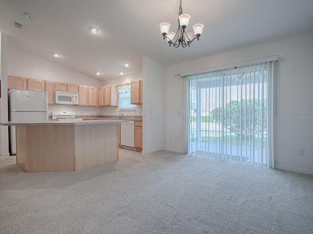 kitchen featuring vaulted ceiling, a kitchen island, hanging light fixtures, light brown cabinets, and white appliances