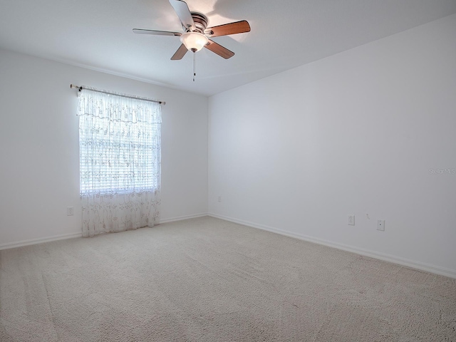 carpeted empty room with ceiling fan