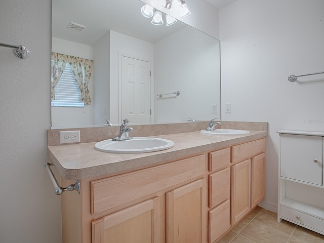 bathroom with tile patterned flooring and vanity