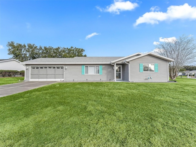 ranch-style house featuring a garage and a front yard